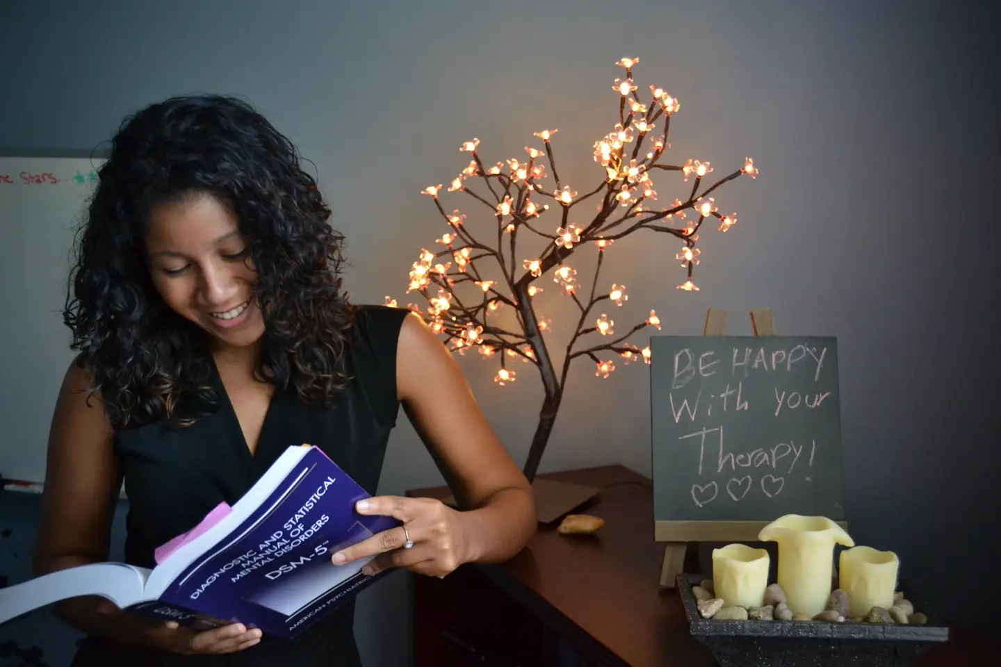 Image of a woman reading a textbook.