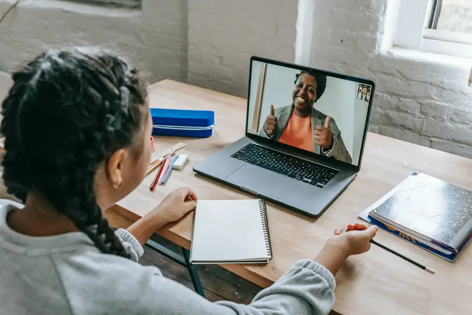 two women talk over video chat