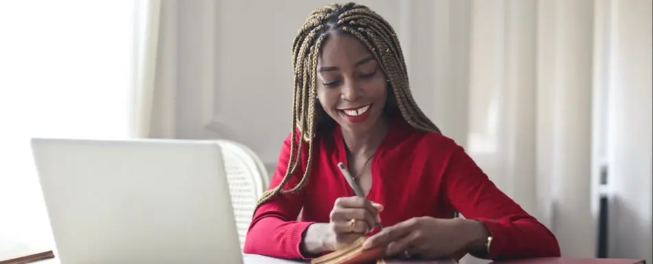 woman writing in notebook